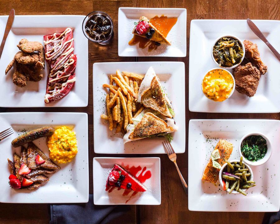 Image of different restaurant quality meals such as chicken and waffles.